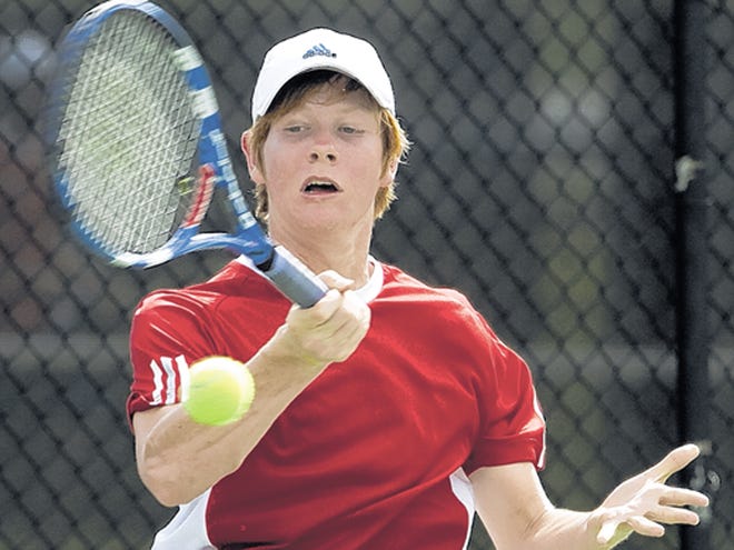 All Saints' Academy's Tyler Pate returns a volley against Lakeland High School's Danny Mack during the boys No. 1 singles match during the Polk County High School Tennis Tournament at the Beerman Family Tennis Center in Lakeland Wednesday. Mack won the match. March 7, 2012