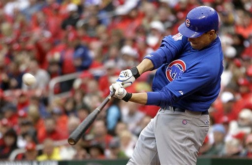 Chicago Cubs' Bryan LaHair hits a grand slam during the third inning of Friday's game against the St. Louis Cardinals in St. Louis. (AP Photo/Jeff Roberson)