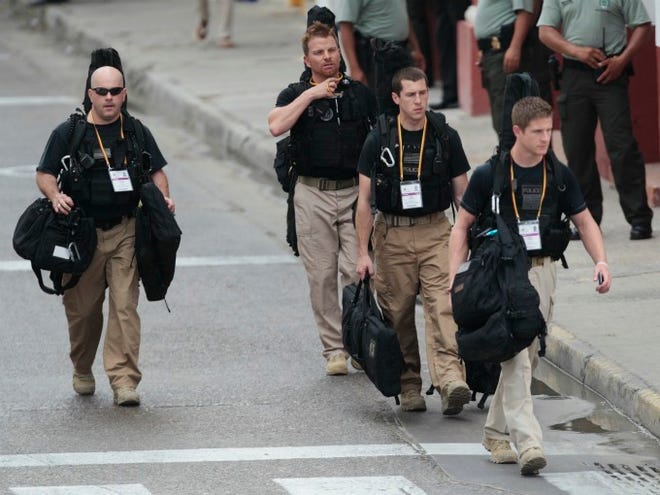 U.S. Secret Service agents walk around the Convention Center in Cartagena, Colombia, prior to the opening ceremony of the 6th Summit of the Americas at the Convention Center in Cartagena, Colombia, on Saturday, April 14, 2012. (AP Photo / Fernando Llano)