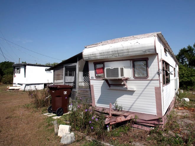A notice of unfit habitation is taped to the window of this mobile home in Lakeside Manor Mobile Home Park.