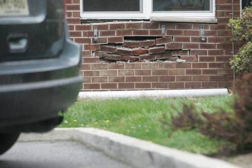 Photo by Daniel Freel/New Jersey Herald - Damage to an exterior wall at Barn Hill Care Center in Newton is seen Sunday.