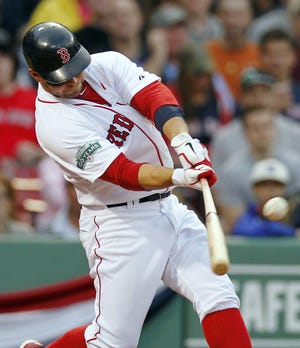 Boston’s Cody Ross hits a two-run double in the seventh inning Saturday against Tampa.