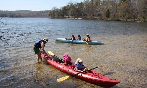 Photo by Derek Prall / New Jersey Herald _ Kayakers enjoy Swartswood Lake as summer-like temperatures move into the county.