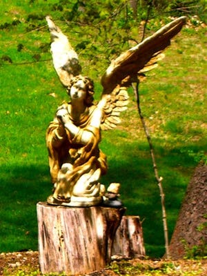 Submitted Photo - This four-foot statue of an angel was stolen from Harmony Hill United Methodist Church in February.