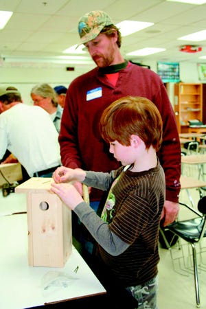 Tim Borst helps his son, Timothy, build a bluebird house during a session at Saturday’s Earth Week Expo . The Expo was the centerpiece event of a month of Earth Week Plus activities that are still ongoing. Visit www.earthweekplus.com for more information.