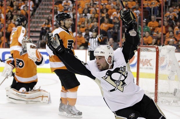 Pittsburgh Penguins' Steve Sullivan, right, celebrates after scoring a goal against Philadelphia Flyers' Kimmo Timonen, center, of Finland, and Sergei Bobrovsky, of Russia, in the second period of Game 4 in a first-round NHL Stanley Cup playoffs hockey series on Wednesday, April 18, 2012, in Philadelphia. (AP Photo/Matt Slocum)