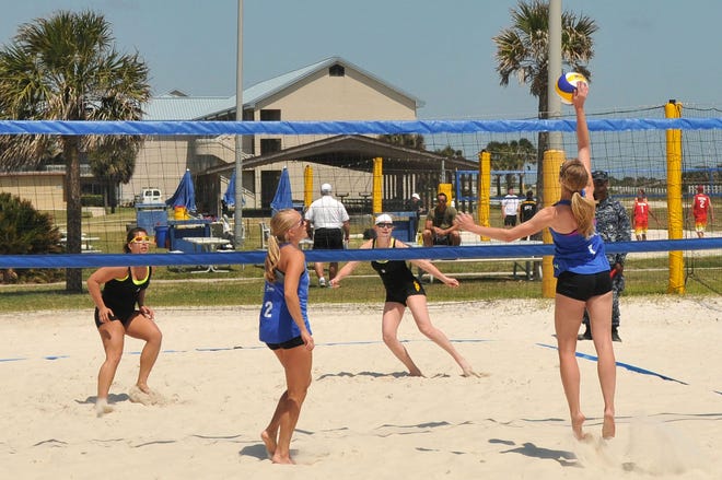 U.S. Air Force 2nd Lt. Katie Bachelder returns the ball during a volleyball match against an U.S. Army team at the 2012 Armed Forces Beach Volleyball Tournament on board NS Mayport.