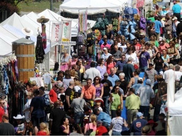People crowd the many vendors on Water Street during the Azalea Festival street fair on Saturday in Wilmington. Staff WILMINGTON STAR NEWS