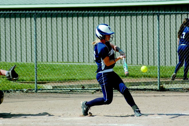 Hillsdale second baseman Miriam McKay swings and is about to make contact during the Chargers’ first game with Grand Valley State Wednesday afternoon.