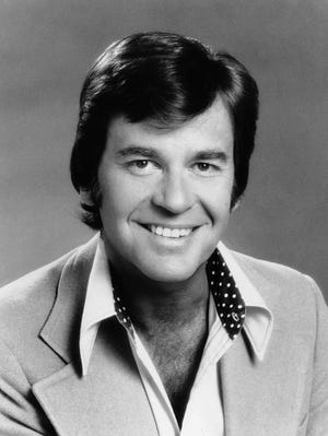 FILE - In this 1974 file photo originally provided by ABC-TV, "American Bandstand" host Dick Clark is shown. Clark, the television host who helped bring rock `n' roll into the mainstream on "American Bandstand," died Wednesday, April 18, 2012 of a heart attack. He was 82. (AP Photo/ABC)