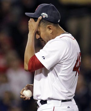 Red Sox relief pitcher Franklin Morales reacts Wednesday after giving up three runs to the Rangers in the eighth inning of a 6-3 Boston loss at Fenway Park.
