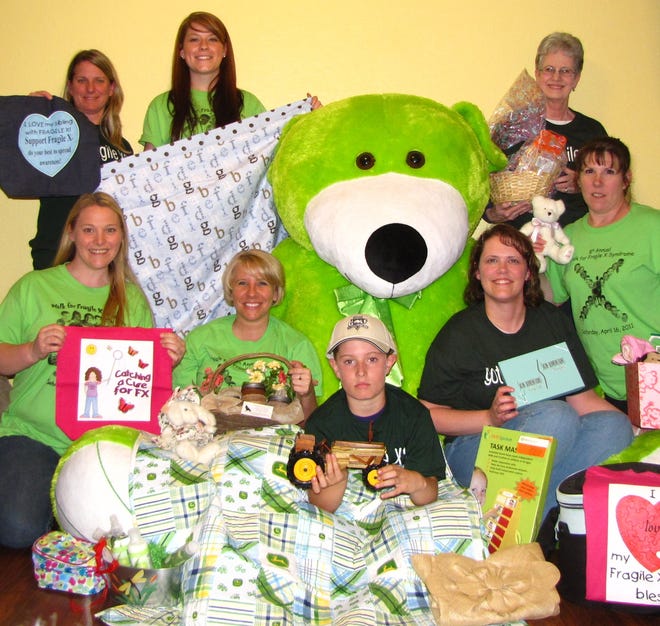 Fragile X Walk
Items donated for the Walk include those displayed by supporters. In the front row from left are Holly Roos, Emily Johnson, Dylan Lyons, Nicole Lincoln, and Lori Driscoll. Back row from left are Kim Lyons, Andrea Wronkiewica, and Kristy Englert.