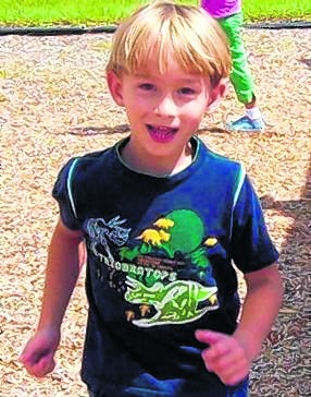 Michael Wisdom, 8, was well liked by his fellow students and his 
principal.H-T ARCHIVE