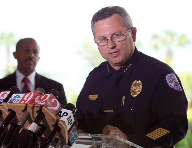 In this March 22, 2012 file photo, Sanford Police Chief Bill Lee speaks to the the media during a news conference as city manager Norton Bonaparte Jr. listens at left, in Sanford Fla. The Sanford City Commission on Monday, April 23, 2012 rejected by a 3-2 vote the resignation of Lee, who was roundly criticized for not initially charging Zimmerman and had stepped down temporarily in March he said to let emotions cool.
