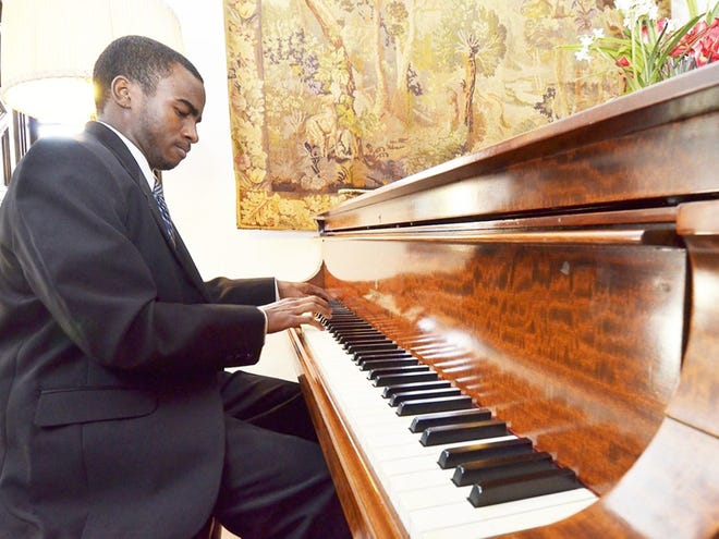Richard Anderson, a student at Harrison Center for the Visual and Performing Arts, plays the 1917 Steinway piano at Pinewood Estate during Bok Tower Garden's 83rd Anniversary Celebration on Wednesday in Lake Wales. Wednesday February 01, 2012.