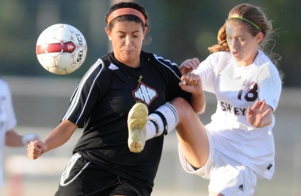 New Hanover's Cheyenne Gordon and Ashley's Paige Laverick battle for possession at Ashley on Tuesday.