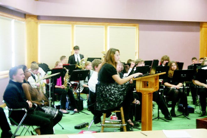 The Reading High School Wind Ensemble is conducted by Szeckley, using real-life examples to illustrate his lesson at the Road Scholar Conference.