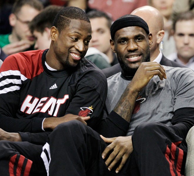 Miami's Dwyane Wade (left) and LeBron James were among many starters who sat out the Celtics' win over the Heat last night.