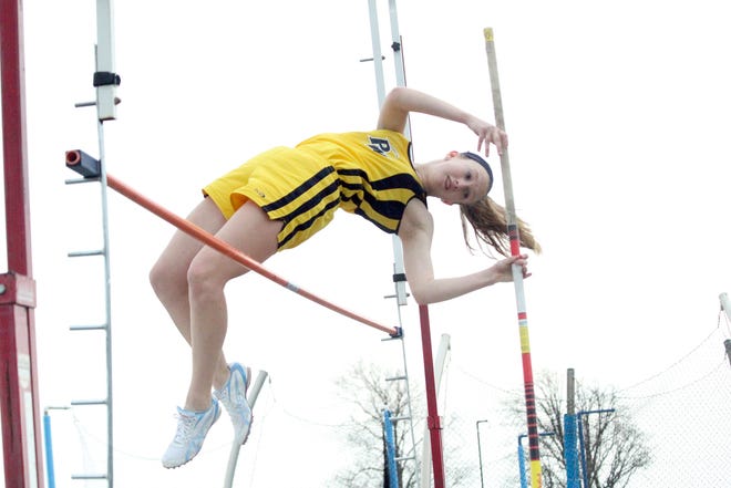 Pewamo-Westphalia’s Sasha Platte clears the bar during the Pole Vault Wednesday night during the Pirates double-dual meet against Bath and Potterville.