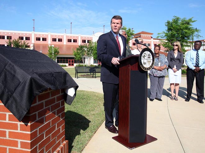 Tuscaloosa Mayor Walt Maddox speaks during an unveiling ceremony for a tornado memorial at Government Plaza in Tuscaloosa Thursday.