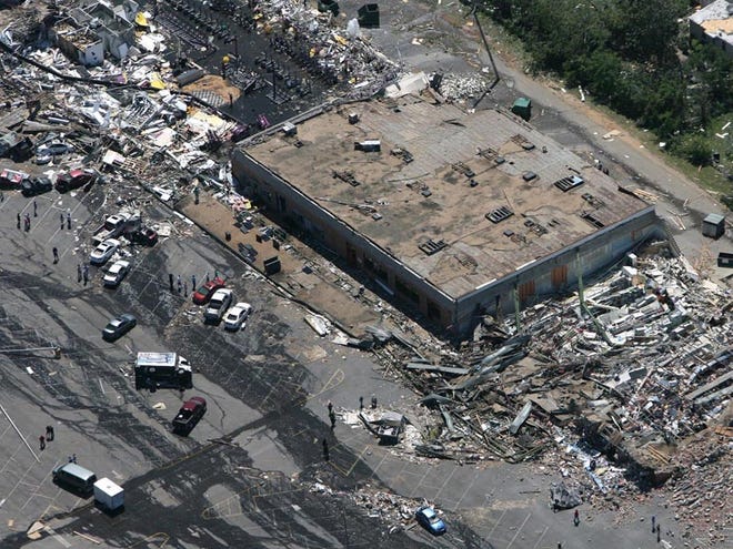 The Wood Square shopping center was destroyed in the April 27, 2011, tornado. It is true there was a birthday party at Chuck E. Cheese that afternoon, but the business closed 30 minutes before the storm hit and the restaurant was empty.
