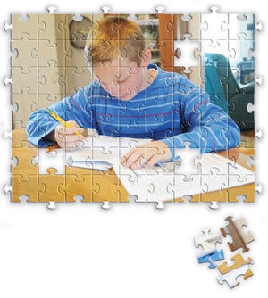 Even during spring break, Ray Hagen, a fourth grader at Gorham Elementary School, has homework to do. Issues stemming from Ray's Asperger's and ADD symptoms have resulted in difficulties in school. (Photo illustration by Paul Gangarossa)