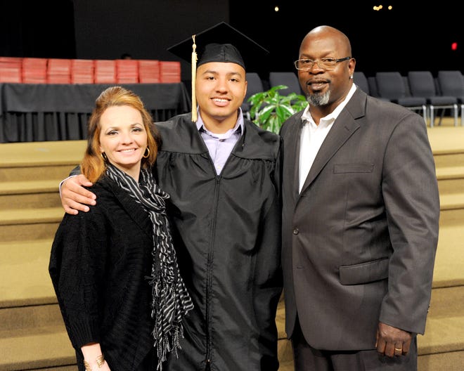 Rodney Long Jr. is photographed with his parents his parents, Carla and Rodney Long Sr. before Malone University commencement held at Faith Family Church in North Canton.