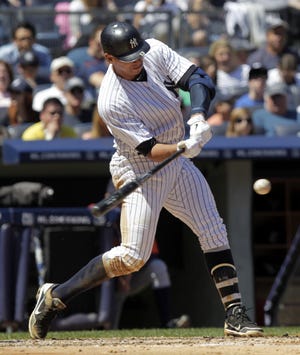 The Yankees’ Alex Rodriguez singles to score Eric Chavez on Sunday during the second inning of a 6-2 win over the Tigers in New York. Rodriguez passed Willie Mays for eighth place on the career RBI list.