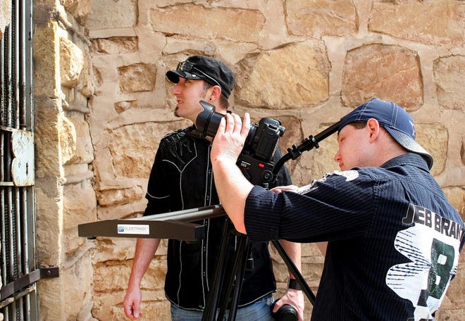 Filmmaker Ryan Mueller (left) and cameraman Jeb Brant film footage for the documentary 'Territorial Prison — Stories Behind the Walls,' which will premier May 4 and 5 during Blossom Festival weekend in Canon City.