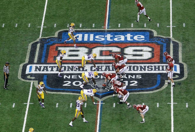 FILE - In this Jan. 9, 2012, file photo, Alabama, right, prepares to snap the ball against LSU during the first half of the BCS National Championship college football game in New Orleans. College football has taken a big step toward having a final four. BCS Executive Director Bill Hancock said, Thursday, April, 26, 2012, that conference commissioners will present a "small number" of options for a four-team playoff to their leagues. (AP Photo/Bill Haber, File)