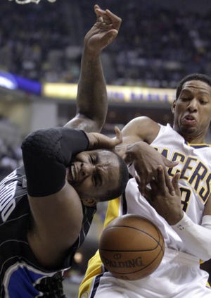 Orlando Magic forward Glen Davis (left) is fouled by Indiana Pacers forward Danny Granger during the first half of Game 2 of an NBA first-round playoff series in Indianapolis, Monday. (AP Photo/Michael Conroy)