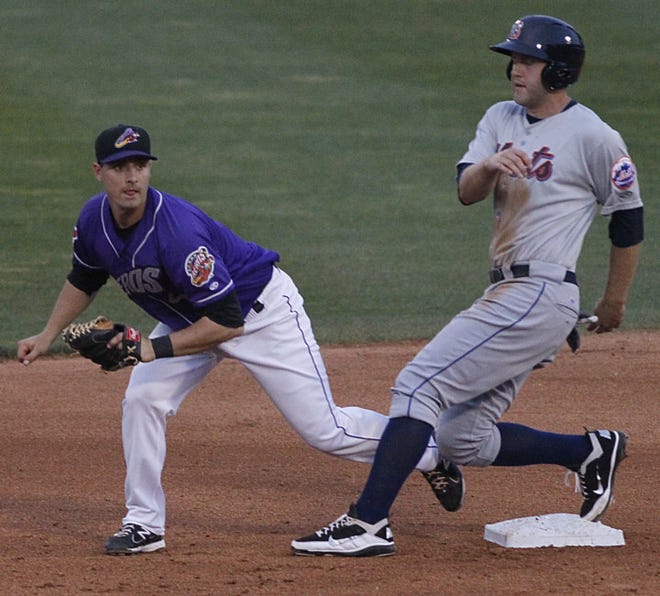 Binghampton Mets Eric Campbell (21, right) is safe at second base with Aeros Ryan Rohlinger on the play in the fourth inning at Canal Park on Monday, April 20, 2012 in Akron, Ohio. (Paul Tople/Akron Beacon Journal)