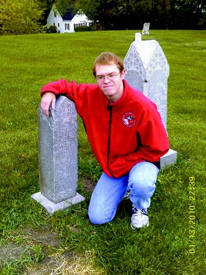 Nicholas Mainz posses at Pioneer Cemetery in Monmouth.