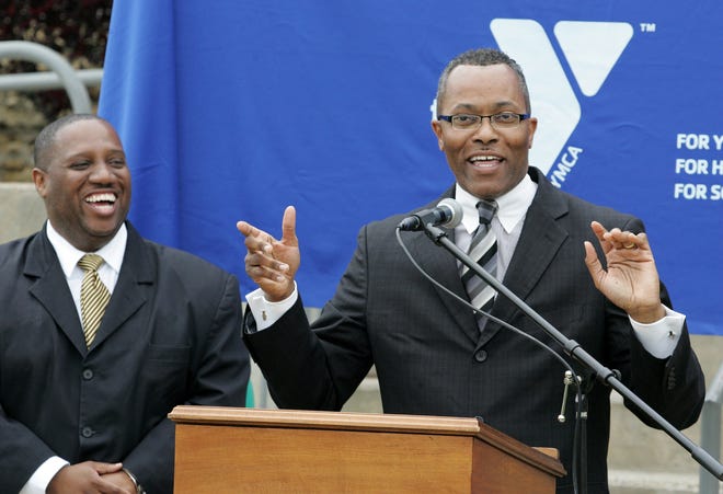 Robert King, board president at Booker Washington Community Center, (right) speaks Tuesday, April 24, 2012, while Ovester Armstrong Jr., executive director of the center, laughs. The pair were leading a news conference to announcing that the YMCA will establish the Willie D. Ashford Sr. YMCA Branch at Booker Washington Community Center.