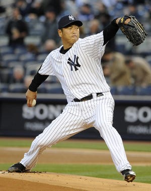 Yankees starting pitcher Hiroki Kuroda throws against the Orioles on Monday during the first inning of New York's 2-1 win at home.