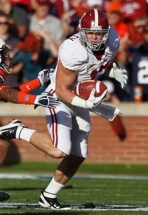 Alabama tight end Brad Smelley (17) looks for running room in the first half of a NCAA college football game against Auburn at Jordan-Hare Stadium in Auburn, Ala., Saturday, Nov. 26, 2011.