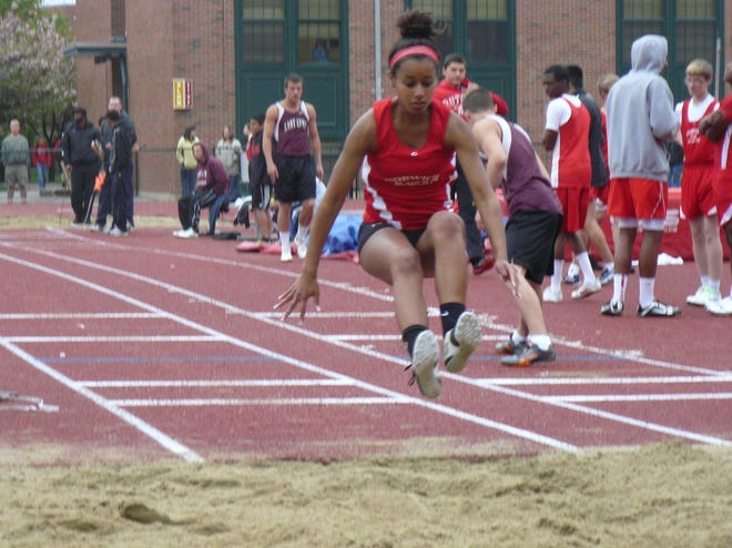 NFA’s Kayla Johnson competes in the long jump Tuesday against East Lyme in Norwich.
