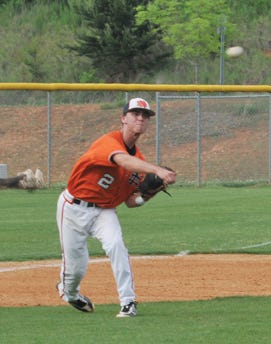 North Davidson third baseman Drew Beaver throws to first after fielding a grounder against Davie County during their Central Piedmont Conference tournament semifinal game on Thursday at Reagan High School.