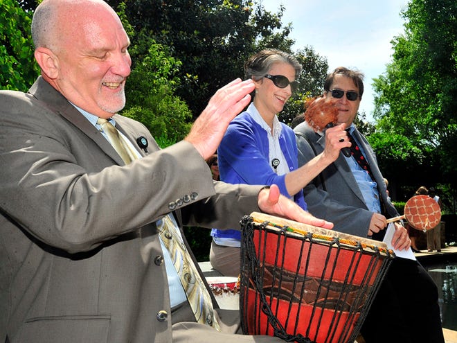 From left, the Rev. Robin Booth, the Rev. Kelly Belcher, and Rabbi Yossi Liebowitz play musical instruments at the start of the celebration of National Day of Prayer program held Thursday at the Gibbs Cancer Center.
