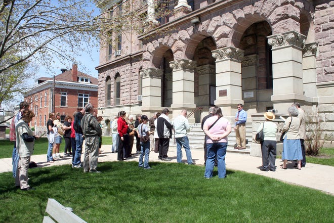 Temple Baptist Pastor John Clark stands on the steps of the Ionia County Courthouse Thursday to lead a group of community members in a ceremony recognizing the National Day of Prayer Thursday.
