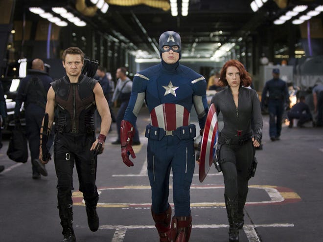 From left, Jeremy Renner (Hawkeye), Chris Evans (Captain America) and Scarlett Johansson (Black Widow) star in “Marvel's The Avengers.”