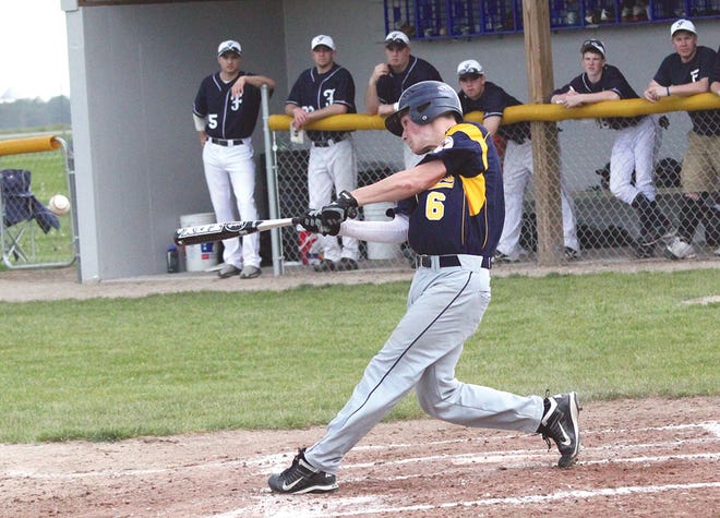 Pewamo-Westphalia’s Kevin Zenk hits the ball back into play Tuesday afternoon during the Pirates suspended game against Fowler. The Eagles were up 2-1 in the sixth when play was suspended due to inclement weather.