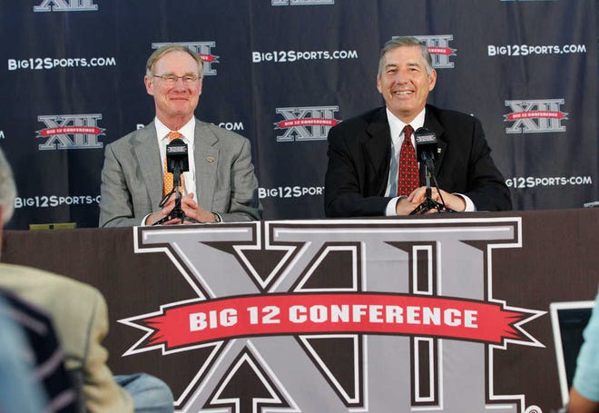 Bob Bowlsby, right, sits next to Oklahoma State President Burns Hargis as Bowlsby is introduced as the the new commisioner of the Big 12 Conference.