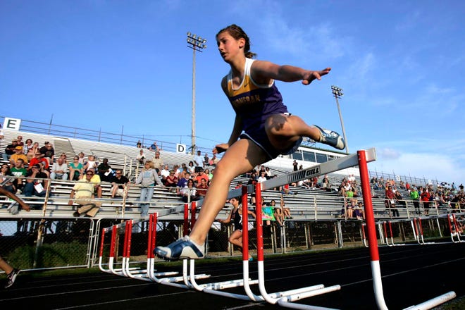 Hononegah's Debbie Pitts clears a hurdle in the 100 meter hurdles Thursday, May 3, 2012, during the NIC-10 girls conference championship meet at Boylan High School in Rockford.