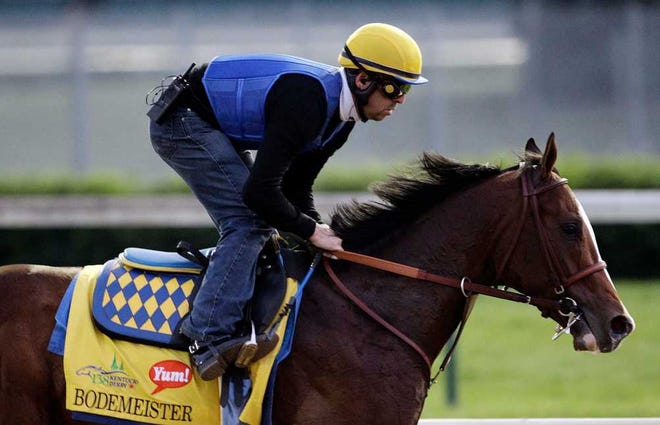 Exercise rider George Alvarez takes Kentucky Derby entrant Bodemeister for a workout at Churchill Downs Friday, May 4, 2012, in Louisville, Ky. (AP Photo/Charlie Riedel)