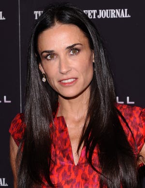 In this Oct. 17, 2011 file photo, actress Demi Moore attends the premiere of "Margin Call" in New York. The 49-year old actress changed her Twitter name to @justdemi on Thursday, May 3, 2012.
