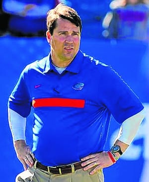 Will Muschamp had a 7-6 record, including a bowl win over Ohio State, in his 
first season as head coach of the Gators.
ASSOCIATED PRESS FILE / 2011