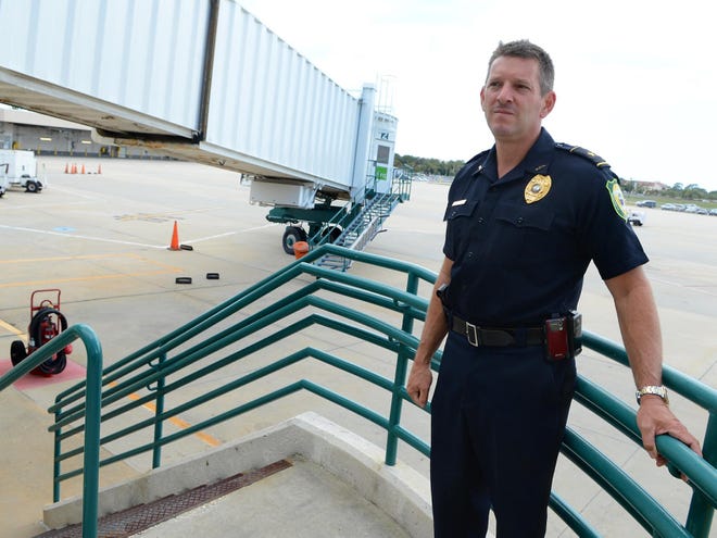 Jim Carlino, chief of police for the Sarasota-Bradenton International Airport, stands near a jet bridge at the airport on April 30. The 10-person department is in turmoil with poor morale high employee turnover and growing questions about the hiring of Carlino a Herald-Tribune investigation has found.