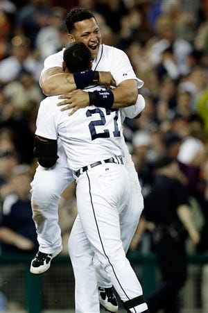 Detroit Tigers' Jhonny Peralta (27) celebrates his two-run home run off Chicago White Sox relief pitcher Matt Thornton with Tigers' Miguel Cabrera in the ninth inning of a baseball game in Detroit, Friday, May 4, 2012. Detroit won 5-4. (AP Photo/Paul Sancya)