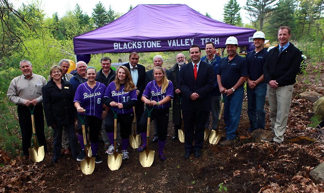 Front row, from left, Valley Tech students and members of the softball team Emelie Wheaton. Valerie Bishop and Bella Picard, School Principal Christopher Cummings. Second row, from left, Jim Brochu, Beth Hennesy, State Rep. John Fernandes, Arthur Morin, Gerald Finn, Harvey Trask, Michael Fitzpatrick, Michael Peteron, Brian MacEwen, Jogn Case III, were present for the groundbreaking and official start to construction of a new softball field for Blackstone Valley Vocational Regional High School Friday afternoon in Upton.